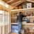 man organizing his wooden shelves