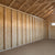 Interior view of the Maker 16x16 shed, featuring ample space and shelving for organized storage