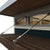 Close-up of a studio shed’s transom windows and wooden pergola accent for added style and natural light.
