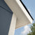 Close-up of the wooden shed's detailed corner trim and roofline, showcasing its sturdy and stylish construction