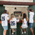 People hanging around the bar shed watching football