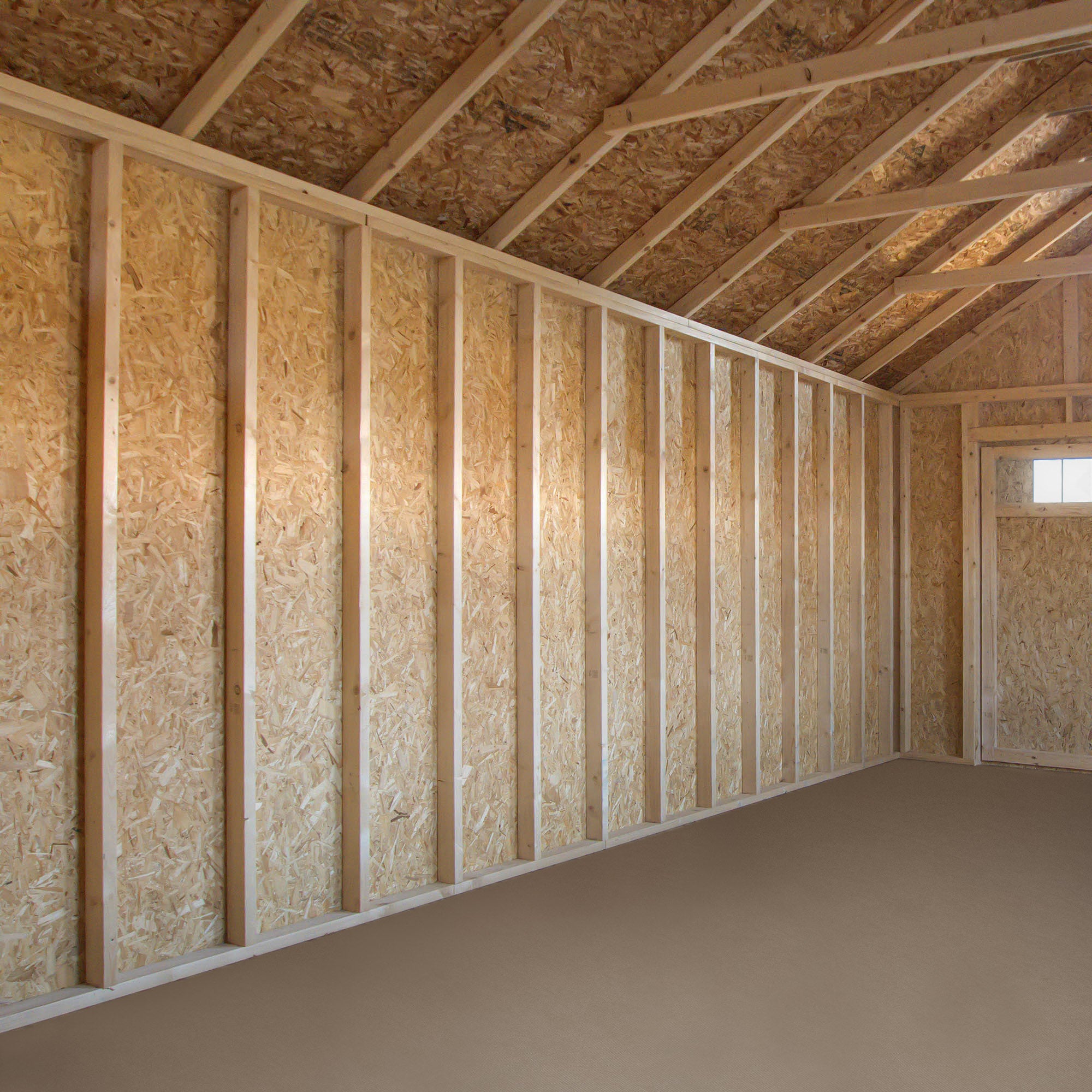 Spacious 16x16 garage interior with durable flooring, exposed framing, and ample storage space for tools and equipment.