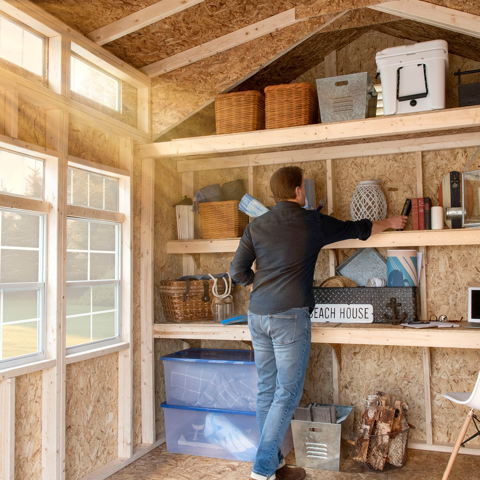 man organizing his wooden shelves 