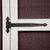 close up of the decorative hinges on the wood door