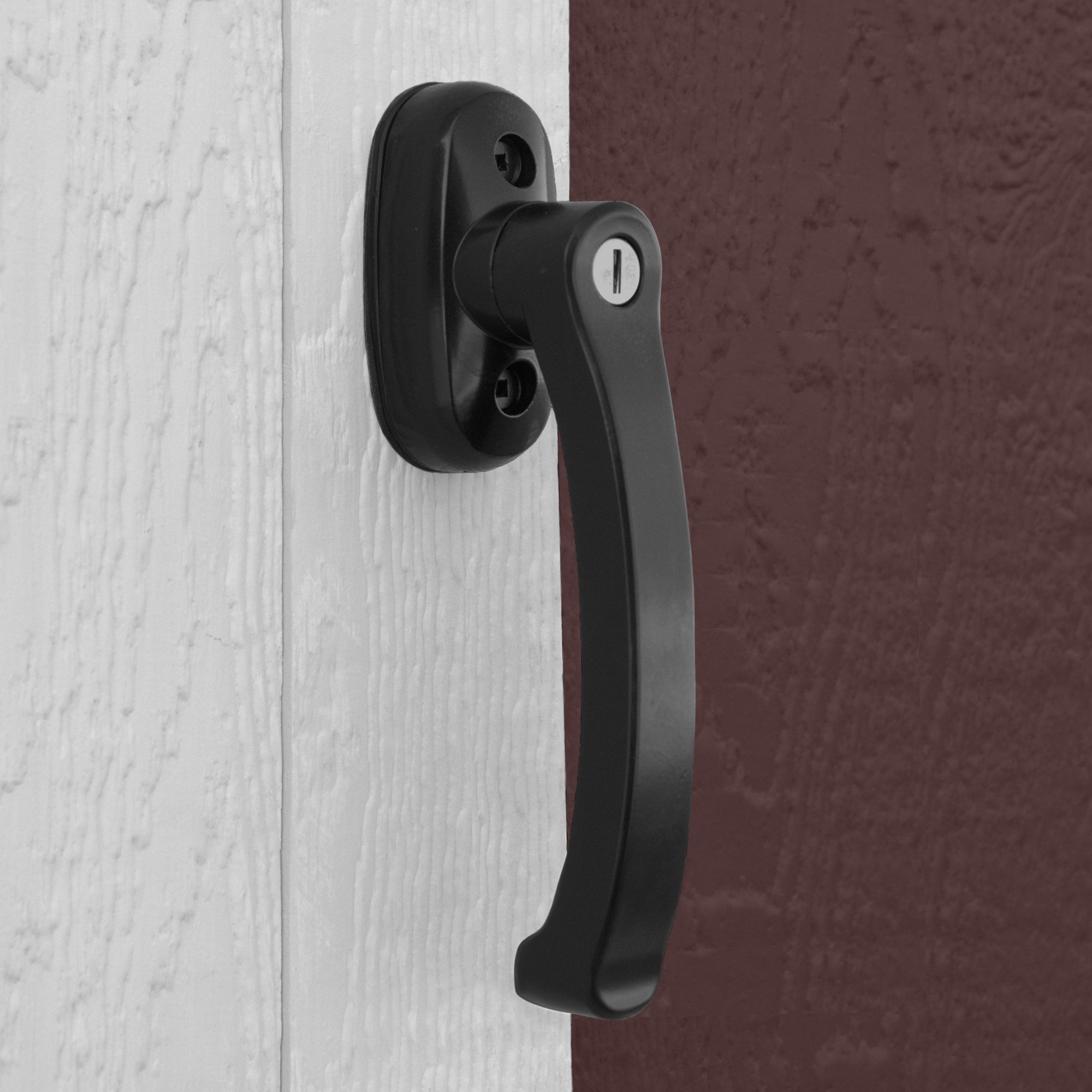 Close up of the handle and lock system on the wooden shed door
