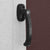 Close up of the handle and lock system on the wooden shed door