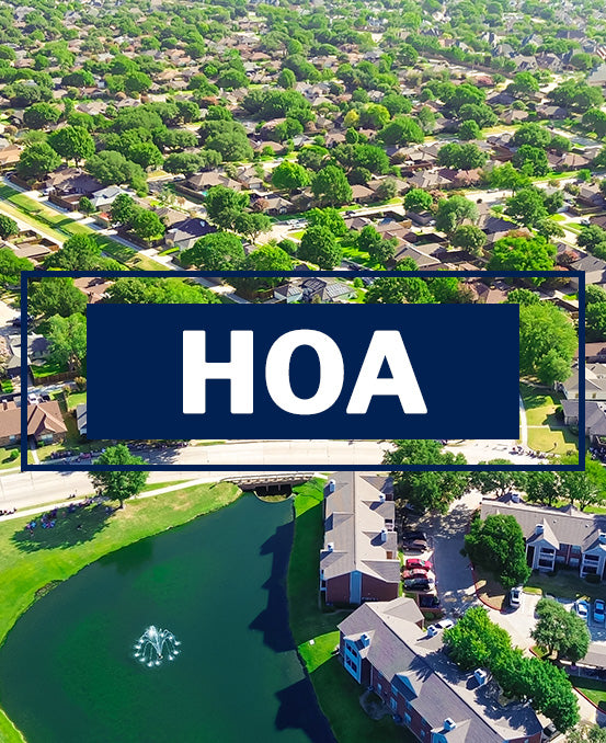 Aerial view of a neighborhood with a lake and HOA sign overlay