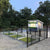 Small shed with a green with golf tee for driving practice and black fence