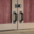 close up of the handles and locks for the bar doors 