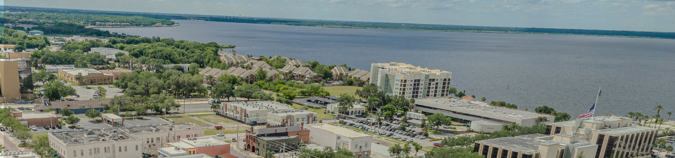 Aerial view of Sanford, Orlando, Florida area with buildings and the ocean.